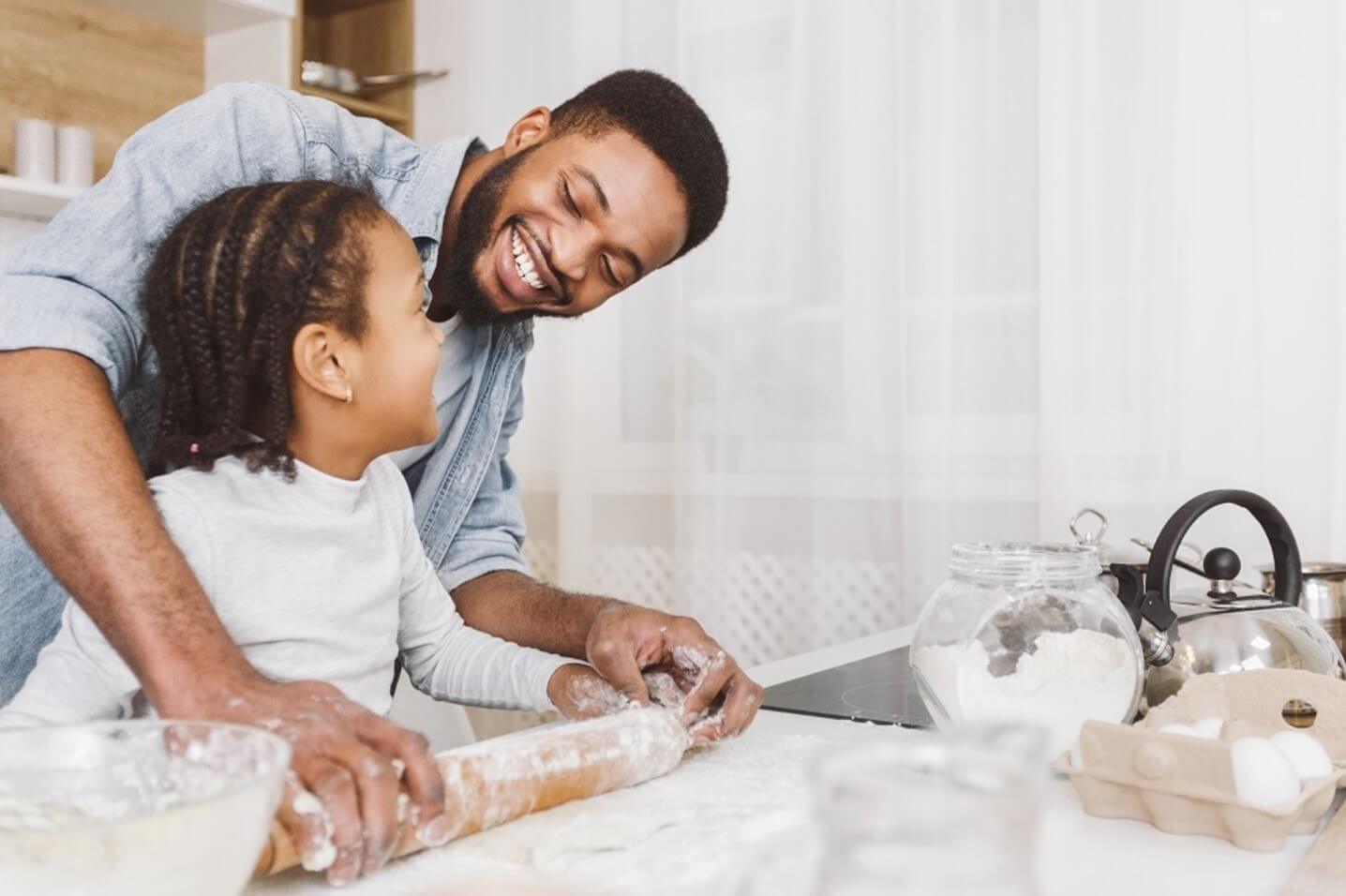 dad and child making pizza