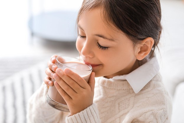 little girl drinking milk