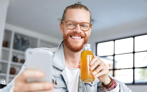 man drinking beverage