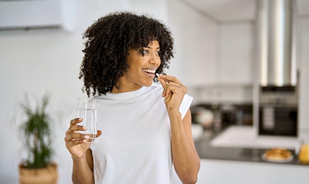 woman taking supplement