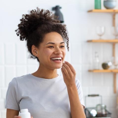 woman taking supplement 