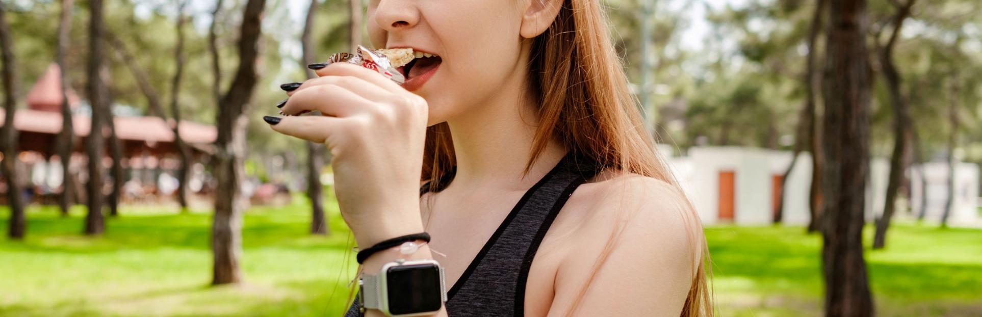 woman eating bar