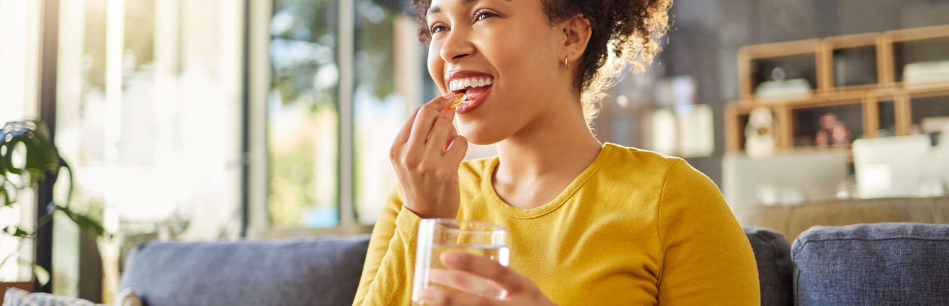 woman taking supplement