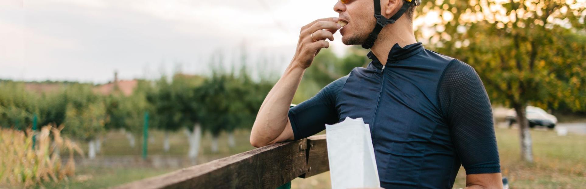 Man snacking on bike