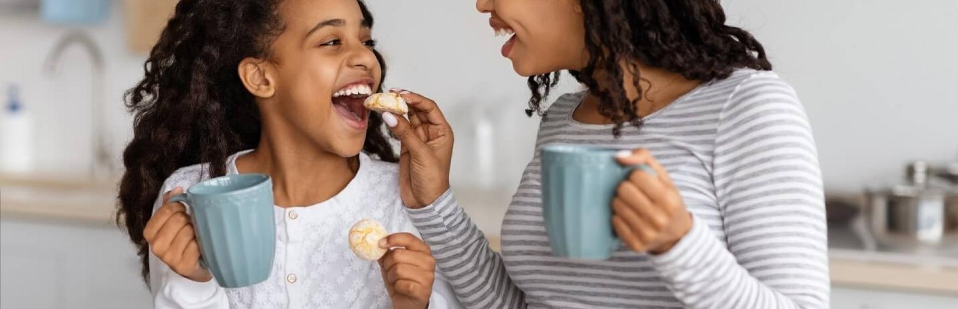 mom and daughter eating cookies