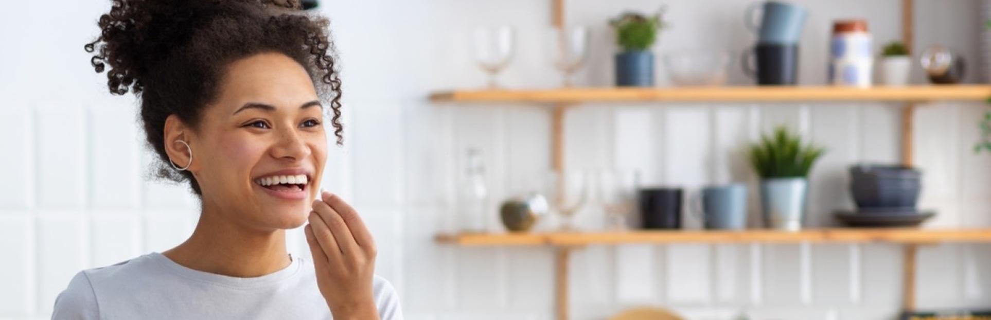 woman taking supplement 