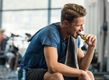 woman on bike drinking water