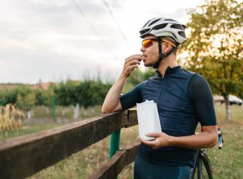 Man snacking on bike