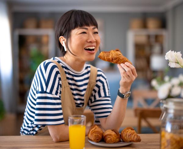 Woman eating bakery item