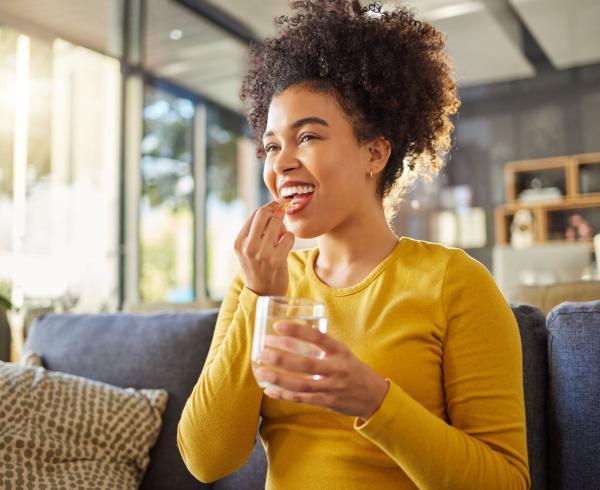 woman taking supplement