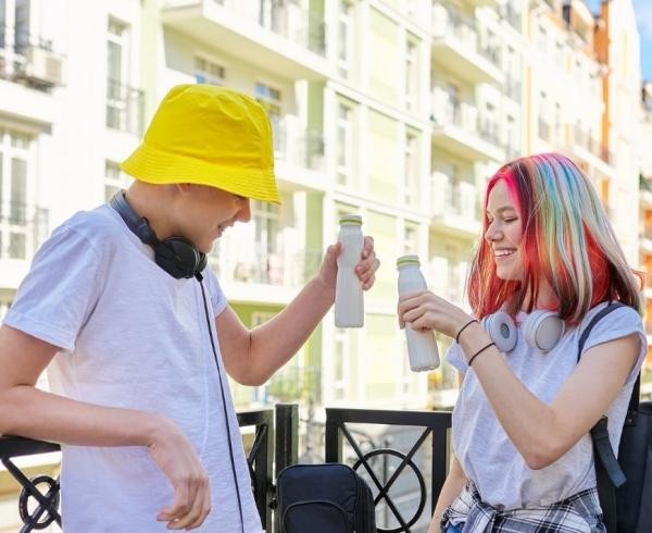 couple driking kefir on balcony