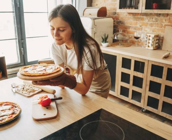 girl looking at pizza