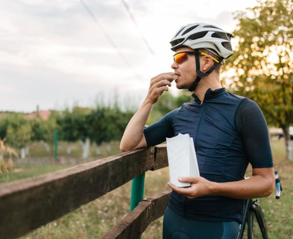 Man snacking on bike