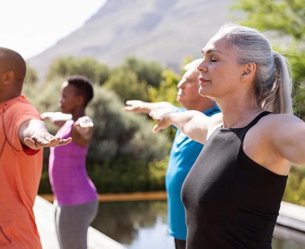 people doing yoga outdoors