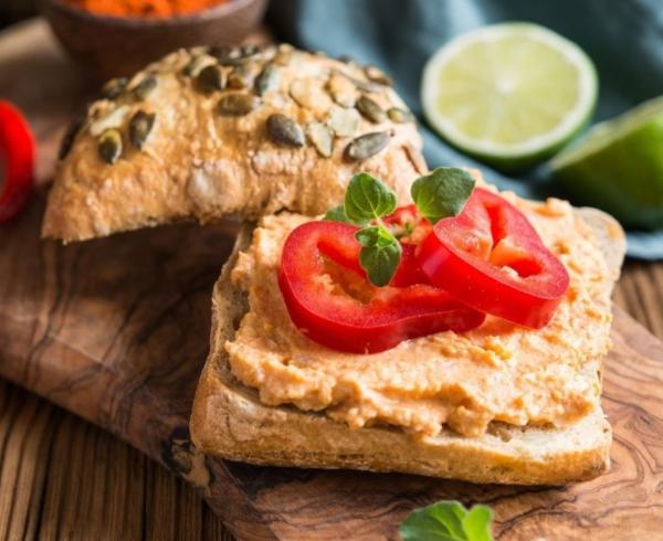 spreadable sauces on bread with wooden sandwich board