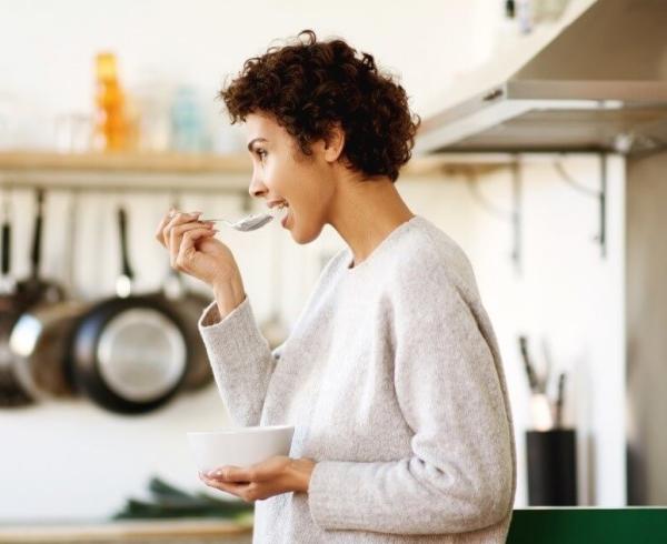 woman eating yogurt